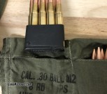 Close-up of Enblock M1 Garand clikps with bandolier